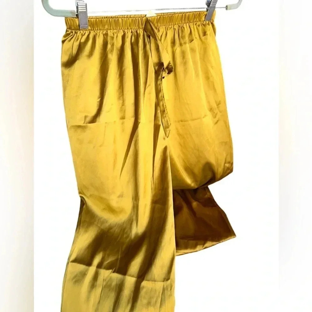 Size small chartreuse polyester satin pajama bottoms with elastic waist. NWOT